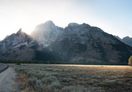 A well timed view of the sun setting behind the Grand Tetons.